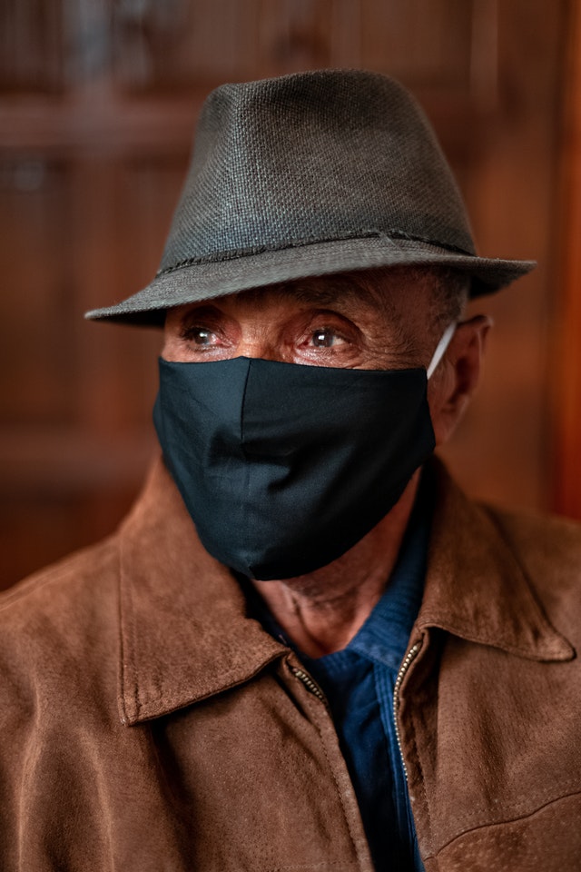 elderly man in mask